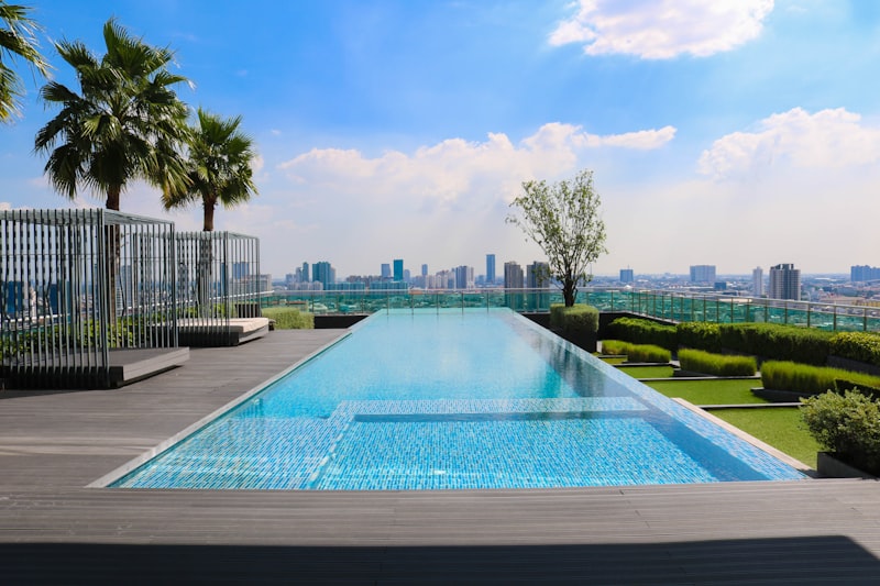 Professional LED pool lighting installation with illuminated modern pool at night